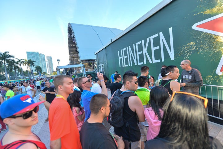 MIAMI, Fl - MARCH 15: Festival-goers don’t miss a beat while getting a beer in Heineken’s immersive new installation at Ultra Music Festival on March 15, 2013 in Miami, Florida. (Photo by Gustavo Caballero/Getty Images for Heineken)