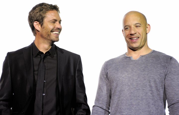 US actors Vin Diesel (R) and Paul Walker pose during a photocall ahead of the European premiere of the movie 'Fast & Furious'