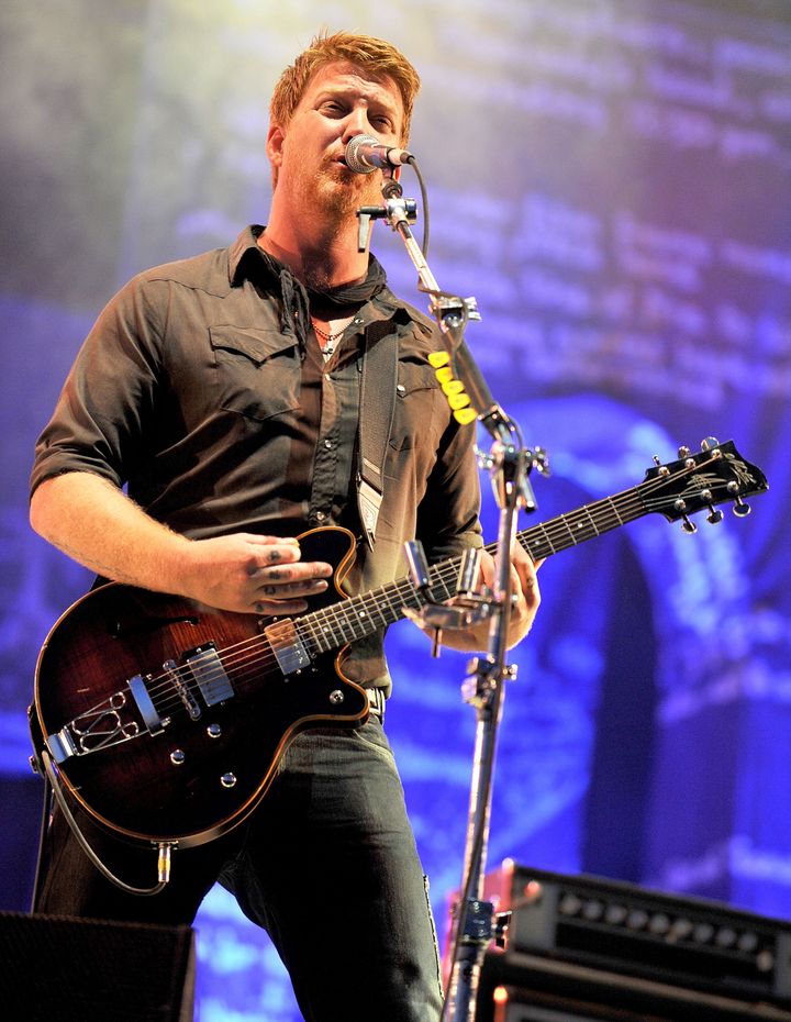GLASTONBURY, ENGLAND - JUNE 26: Josh Homme of Queens of the Stone Age performs on day four of Glastonbury Festival at Worthy Farm on June 26, 2011 in Glastonbury, England. (Photo by Shirlaine Forrest/WireImage)