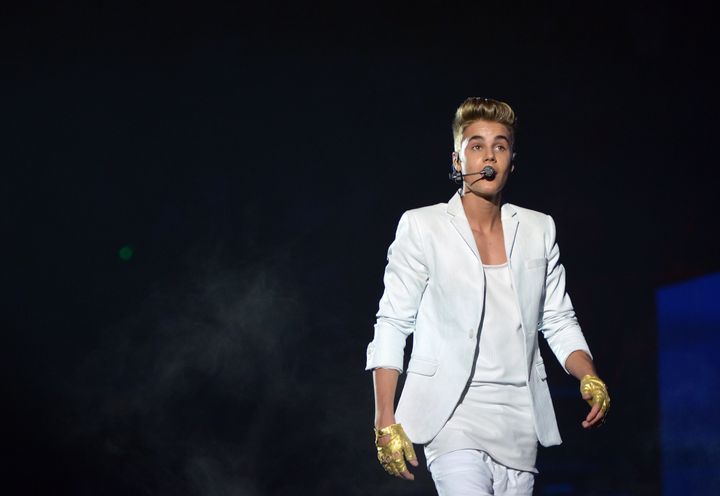 Canadian singer Justin Bieber performs during a concert as part of his 'I Believe' tour at the Palais Omnisport de Paris-Bercy (POPB), on March 19, 2013. AFP PHOTO / MIGUEL MEDINA (Photo credit should read MIGUEL MEDINA/AFP/Getty Images)