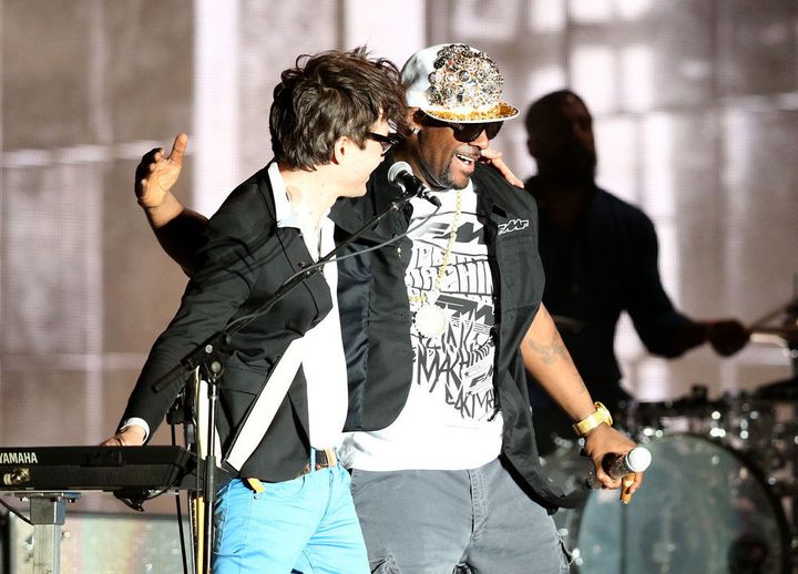 INDIO, CA - APRIL 13: Rapper R. Kelly (R) performs with musician Laurent Brancowitz (L) of Phoenix onstage during day 2 of the 2013 Coachella Valley Music & Arts Festival at the Empire Polo Club on April 13, 2013 in Indio, California. (Photo by Christopher Polk/Getty Images for Coachella)