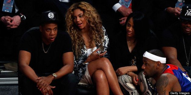 HOUSTON, TX - FEBRUARY 17: Rapper Jay-Z and Beyonce look over at LeBron James #6 of the Miami Heat and the Eastern Conference during the 2013 NBA All-Star game at the Toyota Center on February 17, 2013 in Houston, Texas. NOTE TO USER: User expressly acknowledges and agrees that, by downloading and or using this photograph, User is consenting to the terms and conditions of the Getty Images License Agreement. (Photo by Scott Halleran/Getty Images)