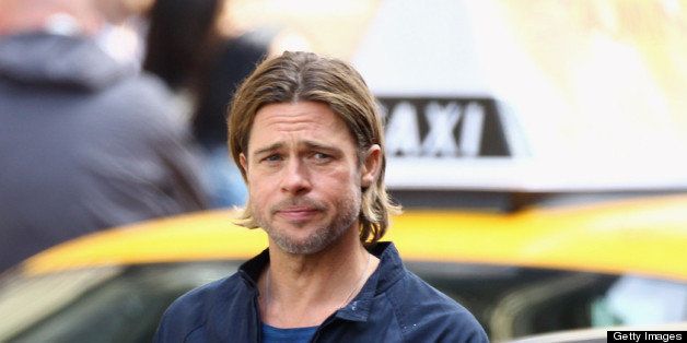 GLASGOW, SCOTLAND - AUGUST 18: Actor Brad Pitt films a scene from 'World War Z' in Glasgow City centre on August 18, 2011 in Glasgow, Scotland. The film, which is set in Philadelphia, will be shot in various parts of the city transforming it into ruins to shoot a post apocalyptic zombie film. (Photo by Jeff J Mitchell/Getty Images)