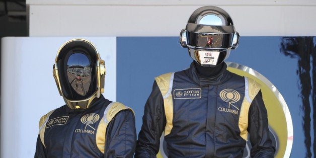 French Daft Punk band members pose in the pits at the Monaco Formula One Grand Prix at the Circuit de Monaco in Monte Carlo on May 26, 2013. AFP PHOTO / BORIS HORVAT (Photo credit should read BORIS HORVAT/AFP/Getty Images)