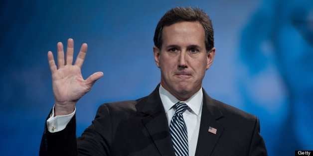 Former US Republican Senator from Pennsylvania Rick Santorum waves after speaking at the Conservative Political Action Confer