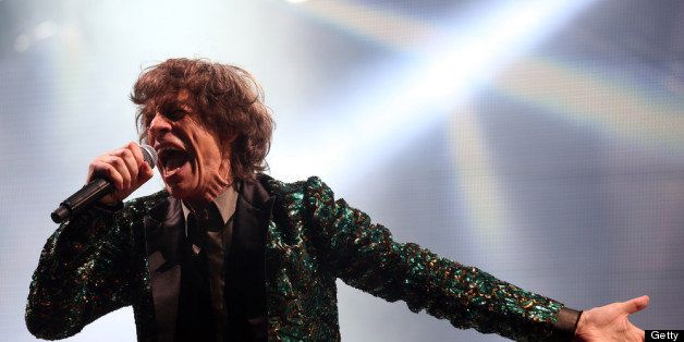 GLASTONBURY, ENGLAND - JUNE 29: Mick Jagger of The Rolling Stones performs on the Pyramid Stage at the Glastonbury Festival of Contemporary Performing Arts site at Worthy Farm, Pilton on June 29, 2013 near Glastonbury, England. The wholesale market caters for traders throughout the Festival who are estimated to provide 3 million meals for festival goers, crew and performers. Gates opened on Wednesday at the Somerset diary farm that will be playing host to one of the largest music festivals in the world and this year features headline acts Artic Monkeys, Mumford and Sons and the Rolling Stones. Tickets to the event which is now in its 43rd year sold out in minutes and that was before any of the headline acts had been confirmed. The festival, which started in 1970 when several hundred hippies paid 1 GBP to watch Marc Bolan, now attracts more than 175,000 people over five days. (Photo by Matt Cardy/Getty Images)