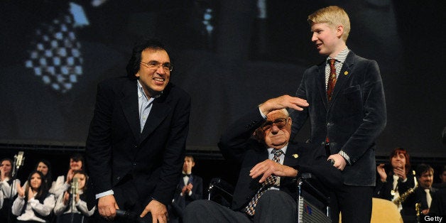 Sir Nicholas Winton, (C), who arranged for the children to be hosted by British families and negotiated their departure with the occupying Nazi Germans between March and September 1939, and Czech film director Matej Minac (L) attend the premiere of 'Nicky's Family', a documentary on the rescue of 669 Jewish children from prewar Czechoslovakia by Winton, on January 20, 2011, in Prague. Winton has been called the 'English Schindler,' in reference to Oskar Schindler, whose rescue of hundreds of Jews in wartime Poland was immortalised in Steven Spielberg's film 'Schindler's List.' Winton's story only came to light by chance 50 years later when his wife found papers relating to it in a battered briefcase in his attic. AFP PHOTO / MICHAL CIZEK (Photo credit should read MICHAL CIZEK/AFP/Getty Images)