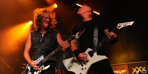 SAN DIEGO, CA - JULY 19: Musicians Kirk Hammett (L) and James Hetfield of Metallica perform a secret concert in celebration of 'Metallica Through The Never' during Comic-Con International 2013 at Spreckels Theatre on July 19, 2013 in San Diego, California. (Photo by Kevin Winter/Getty Images for BB Gun)