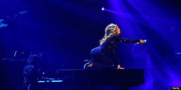 EAST RUTHERFORD, NJ - JULY 31: Entertainer Beyonce performs on stage during 'The Mrs. Carter Show World Tour' at the Izod Center on July 31, 2013 in East Rutherford, New Jersey. Beyonce wears a royal blue hand-beaded jumpsuit by Vrettos Vrettakos, Stuart Weitzman shoes and hosiery by Capezio. (Photo by Larry Busacca/PW/WireImage for Parkwood Entertainment)