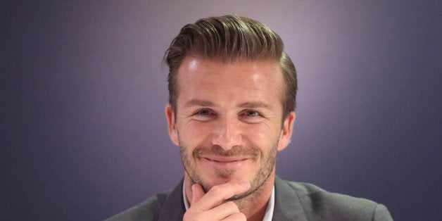 This picture taken on June 25, 2013 shows football superstar David Beckham attending a promotional event in Beijing. Football superstar David Beckham on June 21 sent his love to people hurt in a stampede at a Shanghai event, as fans praised him despite the incident. CHINA OUT AFP PHOTO (Photo credit should read AFP/AFP/Getty Images)