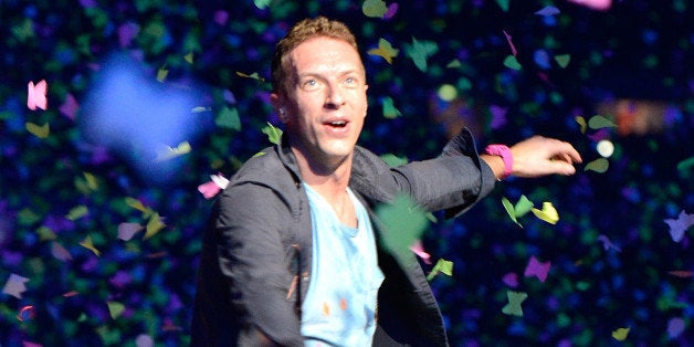 BRISBANE, AUSTRALIA - NOVEMBER 21: Chris Martin of Coldplay performs live for fans at Suncorp Stadium on November 21, 2012 in Brisbane, Australia. (Photo by Bradley Kanaris/Getty Images)