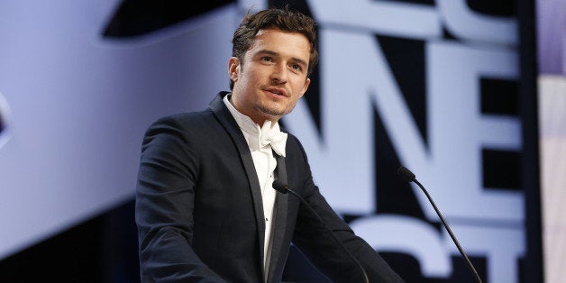 British actor Orlando Bloom speaks on stage to announce on May 26, 2013 the Prix d'Interpretation Feminine (Best Actress) during the closing ceremony of the 66th Cannes film festival in Cannes. AFP PHOTO / VALERY HACHE (Photo credit should read VALERY HACHE/AFP/Getty Images)