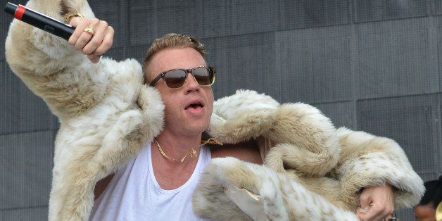 MANCHESTER, TN - JUNE 16: Macklemore performs during the 2013 Bonnaroo Music & Arts Festival on June 16, 2013 in Manchester, Tennessee. (Photo by C Flanigan/Getty Images)