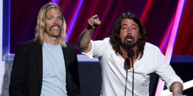 LOS ANGELES, CA - APRIL 18: (L-R) Presenters Taylor Hawkins and Dave Grohl of Foo Fighters speak on stage at the 28th Annua