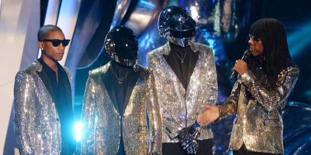 NEW YORK, NY - AUGUST 25: Pharrell Williams, Daft Punk and Nile Rodgers present an award during the 2013 MTV Video Music Awards at the Barclays Center on August 25, 2013 in the Brooklyn borough of New York City. (Photo by Andrew H. Walker/WireImage)