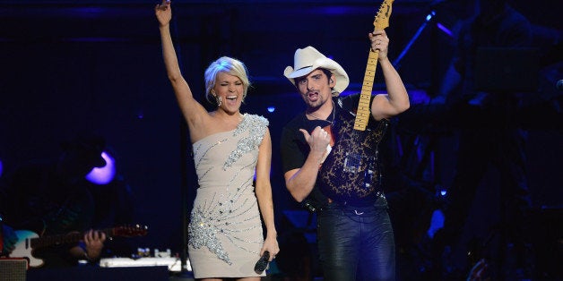 LAS VEGAS, NV - APRIL 07: Musicians Carrie Underwood and Brad Paisley perform onstage during the 48th Annual Academy Of Coun
