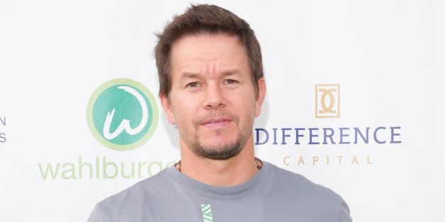 TORONTO, ON - SEPTEMBER 09: Mark Wahlberg arrives on the green carpet at the 'Wahlburgers' premiere at Soho Metropolitan Hotel on September 9, 2013 in Toronto, Canada. (Photo by George Pimentel/WireImage)