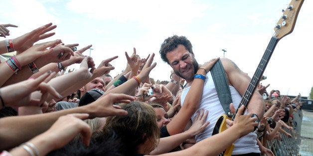 Jared Hasselhoff of Bloodhound Gang performs in front of the front rowd of the audience filled with cheering fans raising their arms and reaching out to him, at Soundwave Festival at the Royal Melbourne Show Grounds on 27th February 2009 in Melbourne, Australia. (Photo by Martin Philbey/Redferns)