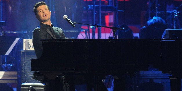 Singer Robin Thicke performs at the BET-SOS Saving Ourselves - Help for Haiti Benefit Concert at AmericanAirlines Arena on February 5, 2010 in Miami, Florida. (Photo by Jeff Kravitz/FilmMagic)