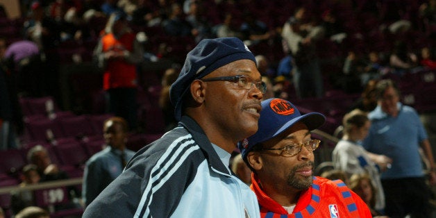 NEW YORK - DECEMBER 12: Actor Samuel L. Jackson, Director Spike Lee and son Satchel stand courtside at the New York Knicks