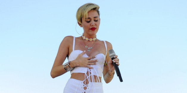 LAS VEGAS, NV - SEPTEMBER 21: Entertainer Miley Cyrus performs onstage during the iHeart Radio Music Festival Village on Sep