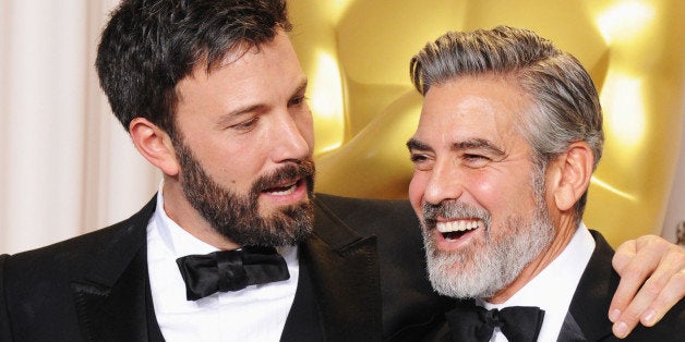 HOLLYWOOD, CA - FEBRUARY 24: Actor/producers Ben Affleck (L) and George Clooney pose in the press room during the Oscars at