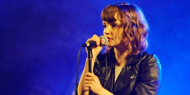 LEEDS, UNITED KINGDOM - AUGUST 24: Lauren Mayberry of Chvrches performs on stage on Day 2 of Leeds Festival 2013 at Bramham Park on August 24, 2013 in Leeds, England. (Photo by Gary Wolstenholme/Redferns via Getty Images)