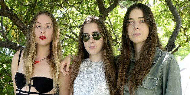 CHICAGO, IL - AUGUST 3: (L - R) Este Haim, Alana Haim, and Danielle Haim of HAIM pose at Lollapalooza 2013 at Grant Park on August 3, 2013 in Chicago, Illinois. (Photo by Tim Mosenfelder/Getty Images)