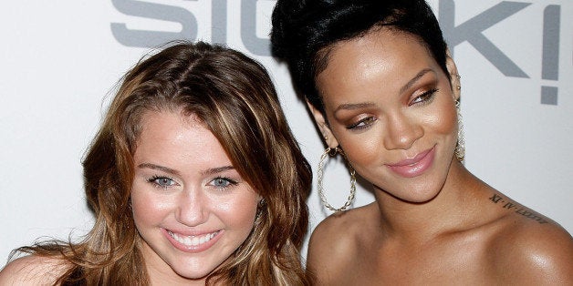 BEVERLY HILLS, CA - FEBRUARY 07: Singers Miley Cyrus (L) and Rihanna attend the 2009 GRAMMY Salute to Industry Icons honorin