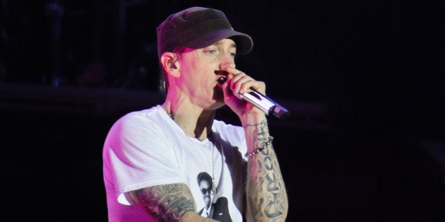 READING, UNITED KINGDOM - AUGUST 24: Eminem performs on stage on Day 2 of Reading Festival 2013 at Richfield Avenue on August 24, 2013 in Reading, England. (Photo by Joseph Okpako/Redferns via Getty Images)