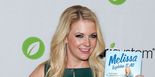 NEW YORK, NY - OCTOBER 29: Actress/author Melissa Joan Hart poses for a photo witha copy of her new book 'Melissa Explains I