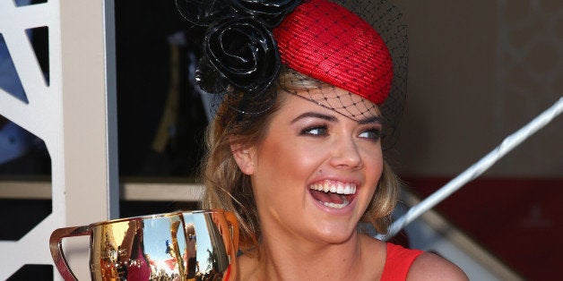 MELBOURNE, AUSTRALIA - NOVEMBER 05: Kate Upton poses with the Melbourne Cup during Melbourne Cup Day at Flemington Racecours