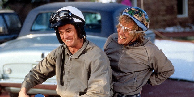Jim Carrey and Jeff Daniels riding bike in a scene from the film 'Dumb & Dumber', 1994. (Photo by New Line Cinema/Getty Image