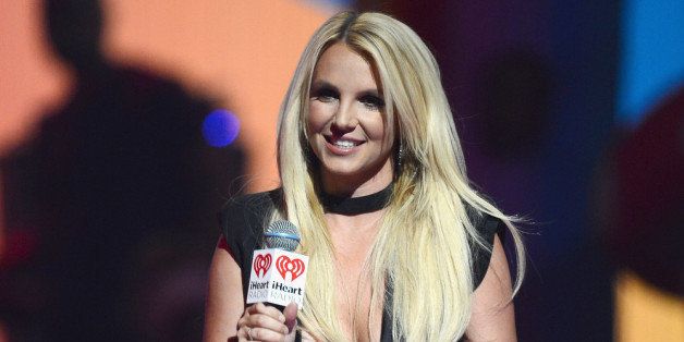 LAS VEGAS, NV - SEPTEMBER 21: Singer Britney Spears introduces a performance by Miley Cyrus during the iHeartRadio Music Festival at the MGM Grand Garden Arena on September 21, 2013 in Las Vegas, Nevada. (Photo by Ethan Miller/Getty Images for Clear Channel)