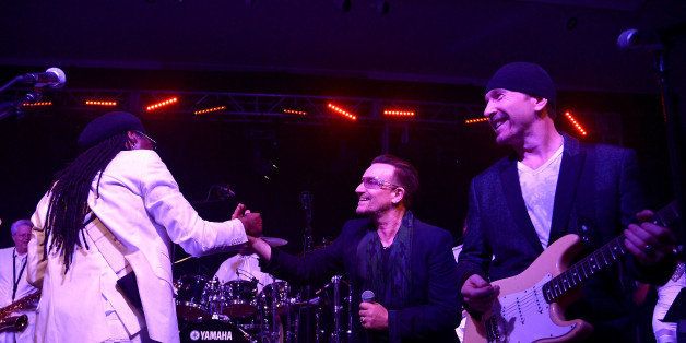 NEW YORK, NY - NOVEMBER 23: (R-L) Nile Rodgers, Bono and The Edge perform onstage at the After Party for Jony And Marc's (RED) Auction at Sotheby's on November 23, 2013 in New York City. (Photo by Mike Coppola/Getty Images for (RED))