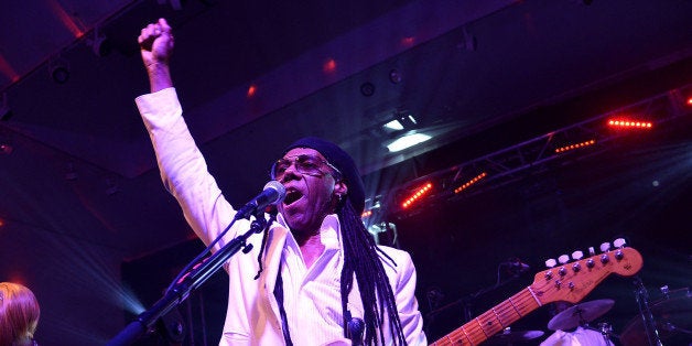 NEW YORK, NY - NOVEMBER 23: Nile Rodgers performs onstage at the After Party for Jony And Marc's (RED) Auction at Sotheby's