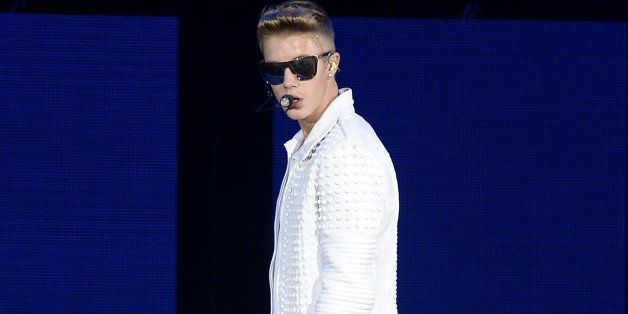 BRISBANE, AUSTRALIA - NOVEMBER 27: Justin Bieber performs live for fans at Brisbane Entertainment Centre on November 27, 2013 in Brisbane, Australia. (Photo by Bradley Kanaris/Getty Images)