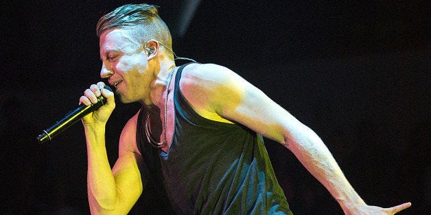 CEDAR PARK, TX - NOVEMBER 29: Rapper Macklemore of Macklemore and Ryan Lewis performs in concert at Cedar Park Center on Nov