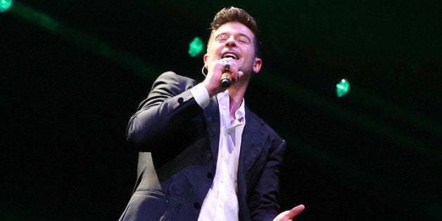 DALLAS, TX - DECEMBER 02: Recording artist Robin Thicke performs onstage during 106.1 KISS FMs Jingle Ball 2013 at American Airlines Center on December 2, 2013 in Dallas, Texas. (Photo by Christopher Polk/Getty Images for Clear Channel)