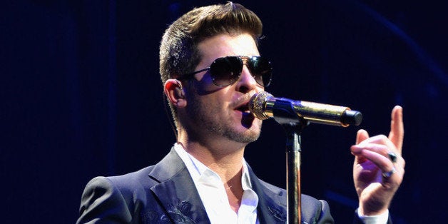 PHILADELPHIA, PA - DECEMBER 04: Singer Robin Thicke performs onstage during Q102s Jingle Ball 2013 presented by Bernie Robbins Jewelers, at Wells Fargo Center on December 4, 2013 in Philadelphia, PA. (Photo by Theo Wargo/Getty Images for Clear Channel)