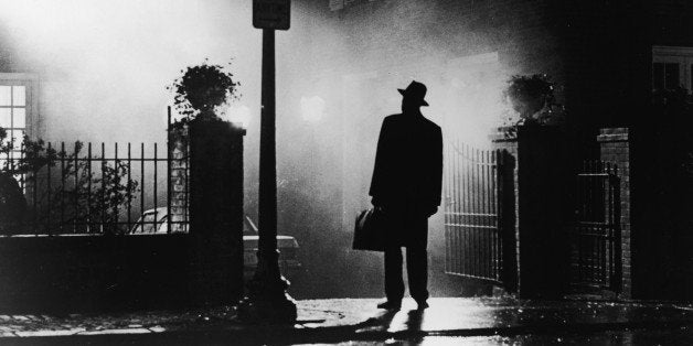 A silhouette of a man stands in front of a house at night in a still from the film,' The Exorcist', directed by William Friedkin, 1973. (Photo by Warner Bros./Courtesy of Getty Images)