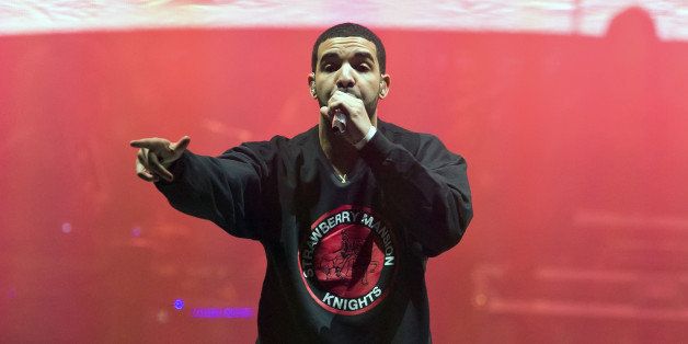 PHILADELPHIA, PA - DECEMBER 18: Rapper Drake performs during the 'Would You Like A Tour? 2013 concert at Wells Fargo Center on December 18, 2013 in Philadelphia, Pennsylvania. (Photo by Gilbert Carrasquillo/Getty Images)