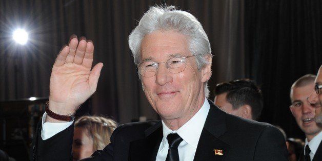 Actor Richard Gere arrives on the red carpet for the 85th Annual Academy Awards on February 24, 2013 in Hollywood, California. AFP PHOTO/VALERIE MACON (Photo credit should read VALERIE MACON/AFP/Getty Images)