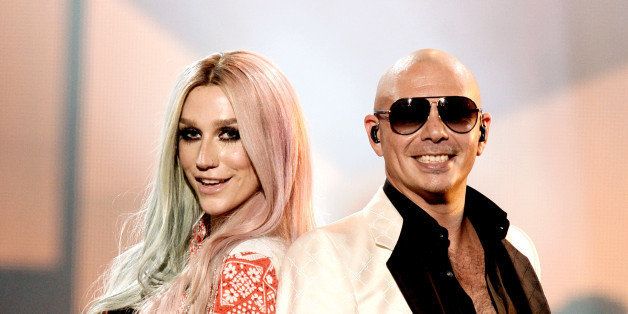 LOS ANGELES, CA - NOVEMBER 24: Singers Ke$ha, (L) and Pitbull perform onstage during the 2013 American Music Awards at Nokia Theatre L.A. Live on November 24, 2013 in Los Angeles, California. (Photo by Kevin Winter/Getty Images)