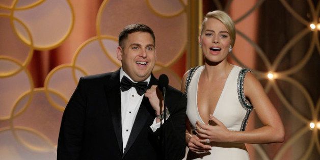 BEVERLY HILLS, CA - JANUARY 12: In this handout photo provided by NBCUniversal, Presenters Jonah Hill and Margot Robbie speak onstage during the 71st Annual Golden Globe Award at The Beverly Hilton Hotel on January 12, 2014 in Beverly Hills, California. (Photo by Paul Drinkwater/NBCUniversal via Getty Images)