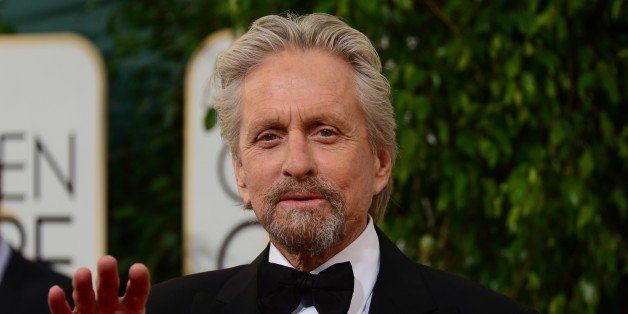 Actor Michael Douglas arrives on the red carpet of the 71st Annual Golden Globe Awards in Beverly Hills, California, on January 12, 2014. AFP PHOTO/Frederic J. BROWN (Photo credit should read FREDERIC J. BROWN/AFP/Getty Images)
