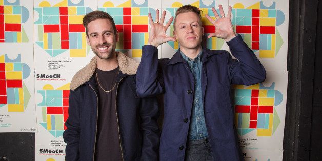 SEATTLE, WA - DECEMBER 14: Ryan Lewis (L) and Macklemore pose for a photo backstage during the(SMooCH) Seattle Musicians for Childrens Hospital benefit at The Showbox Market on December 14, 2013 in Seattle, Washington. (Photo by Mat Hayward/WireImage)