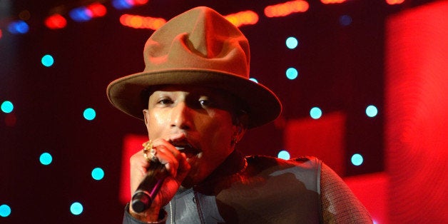 LOS ANGELES, CA - JANUARY 25: Pharrell Williams performs onstage during the 56th annual GRAMMY Awards Pre-GRAMMY Gala and Salute to Industry Icons honoring Lucian Grainge at The Beverly Hilton on January 25, 2014 in Los Angeles, California. (Photo by Kevin Mazur/WireImage)