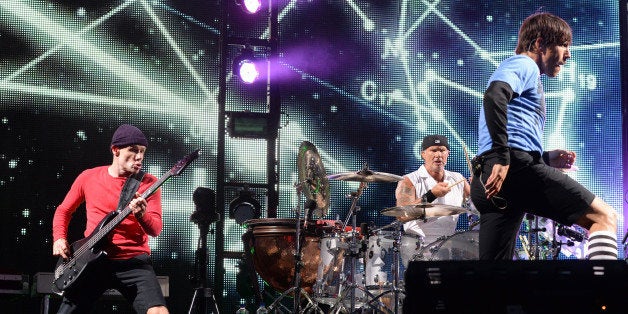 SAN FRANCISCO, CA - AUGUST 11: Flea, Chad Smith, and Anthony Kiedis of Red Hot Chili Peppers perform at the Lands End Stage during day 3 of the 2013 Outside Lands Music and Arts Festival at Golden Gate Park on August 11, 2013 in San Francisco, California. (Photo by Jeff Kravitz/FilmMagic)