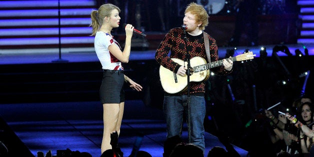 LONDON, ENGLAND - FEBRUARY 01: Seven-time Grammy winner Taylor Swift was joined on stage by Ed Sheeran as she kicked off the European leg of her blockbuster The RED Tour with the first of five sold-out shows at London's O2 Arena, playing to a capacity crowd of more than 15500 fans, on February 1, 2014 in London, England. (Photo by Gareth Cattermole/TAS/Getty Images for TAS)